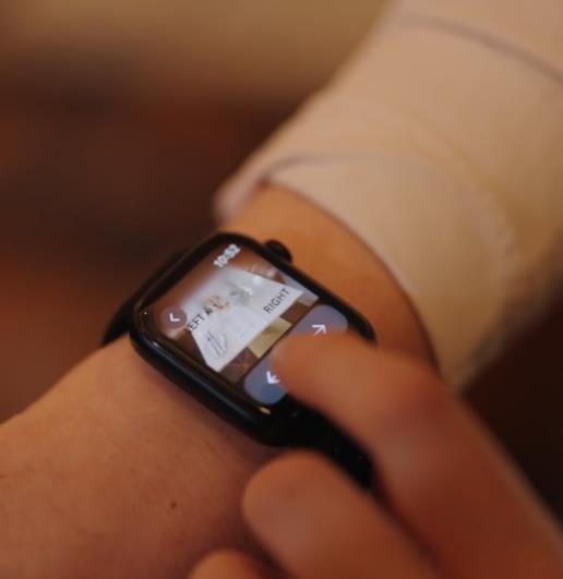 A smartwatch on a wrist showing the next step of a task
