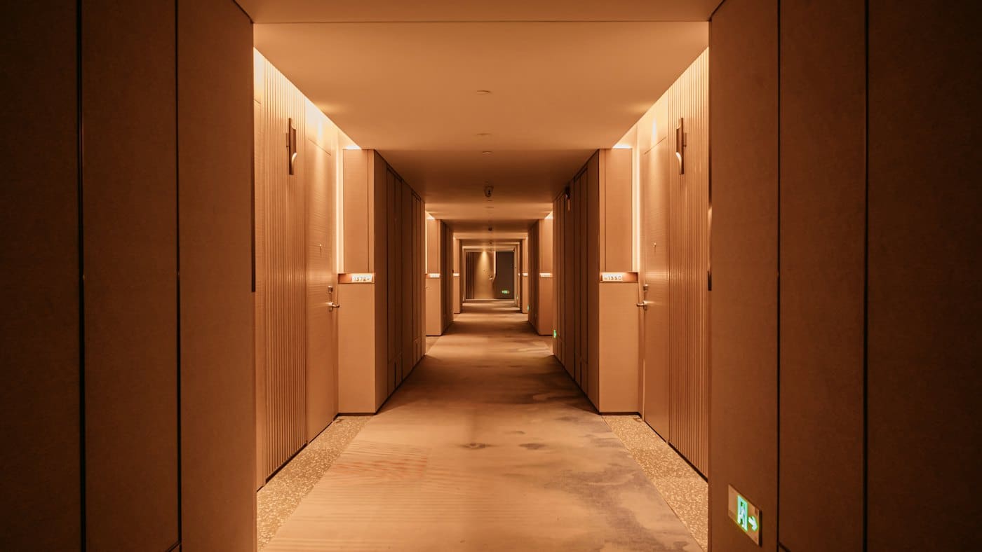A long, clean hotel corridor
