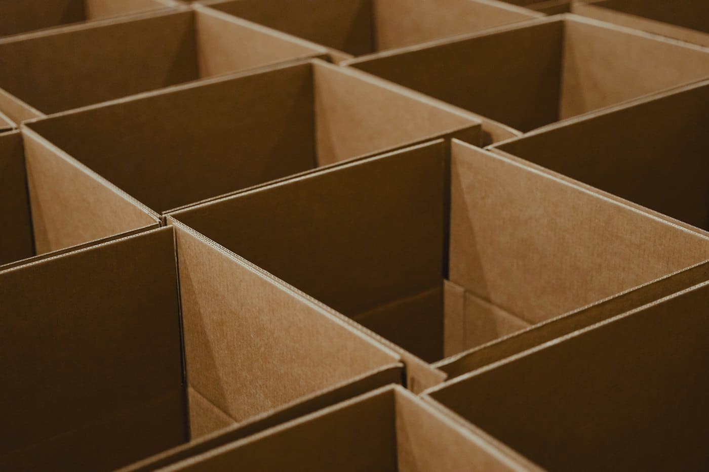 Open cardboard boxes in a warehouse